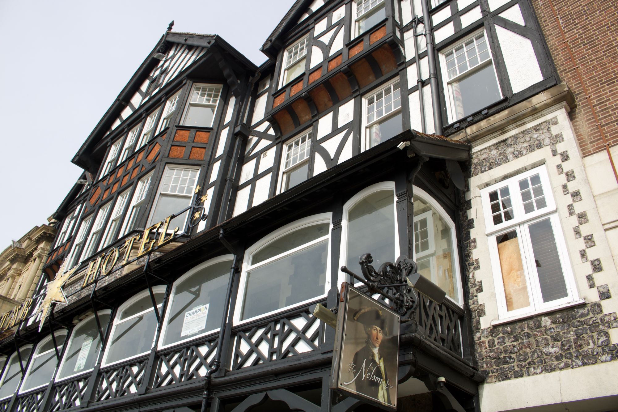 A black-and-white timber-framed hotel building on a Great Yarmouth street